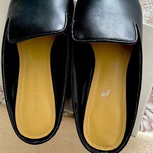 Marc Fisher black patent leather mules with a small scuff on the toes